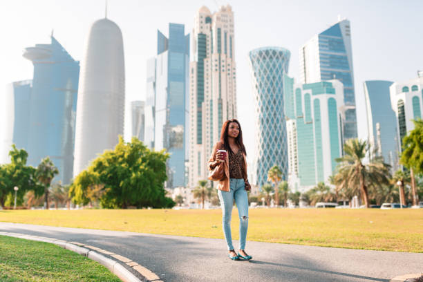 istock tourist in the doha la corniche park walking 682339640