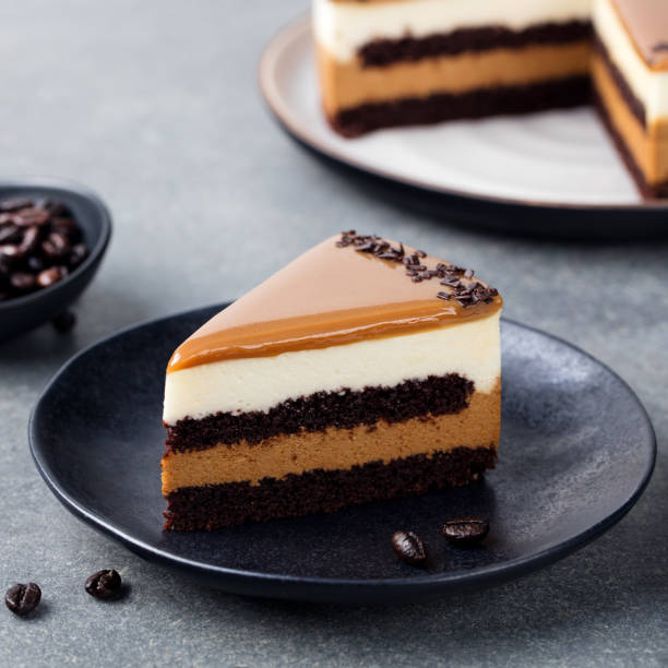 istock Caramel cake, mousse dessert on a plate. Grey stone background 682343134