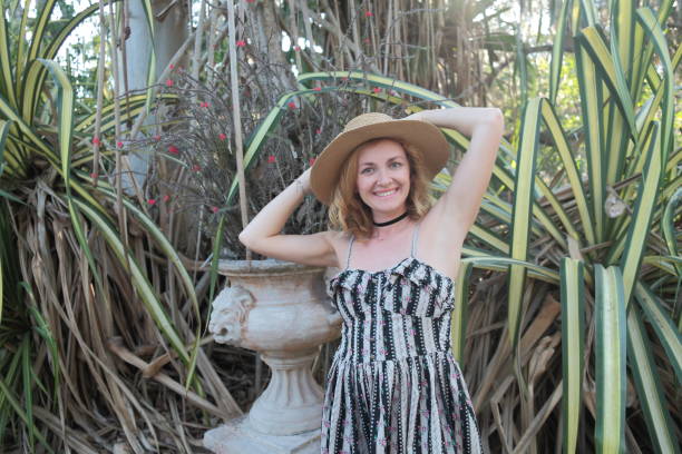 istock Woman in a tropical park. 682343322