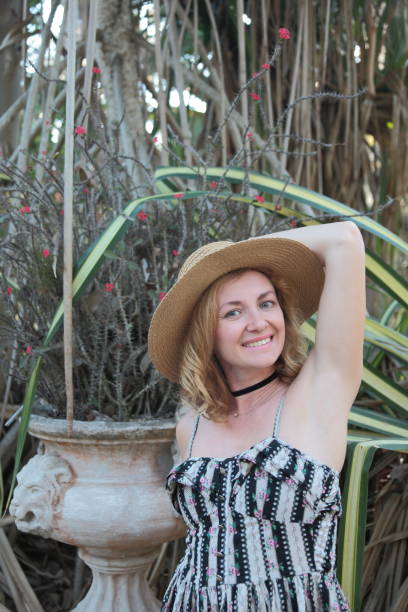 istock Woman in a tropical park. 682349224