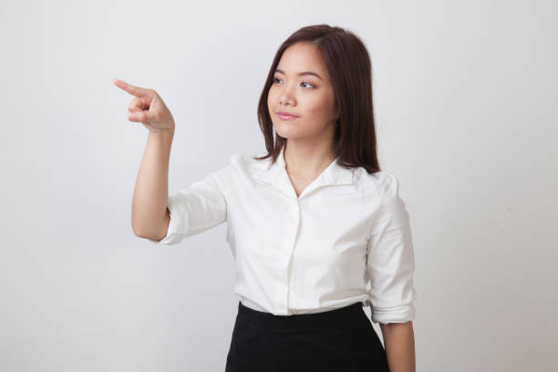 istock Asian woman touching the screen with  finger. 682349428