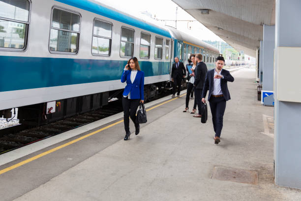 istock Business people on a railroad station waiting for train 682349874