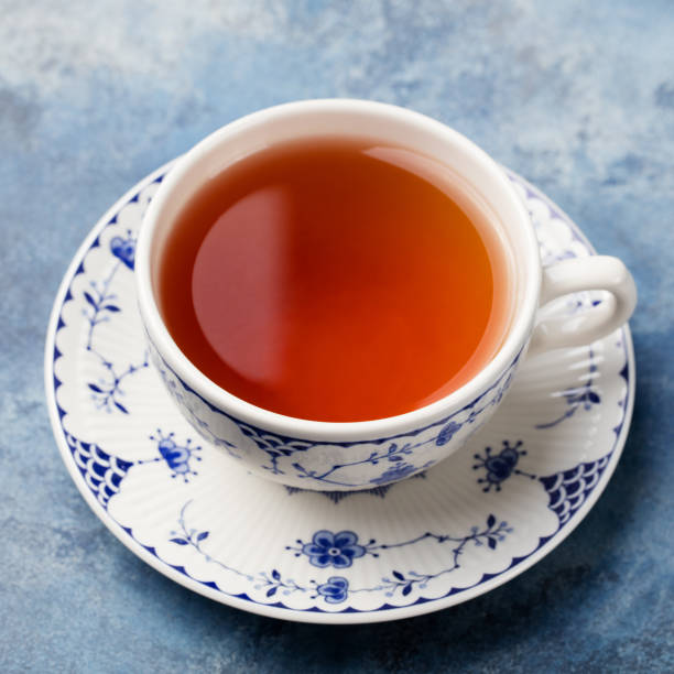 istock Cup of tea on a blue stone background. Copy space 682350050
