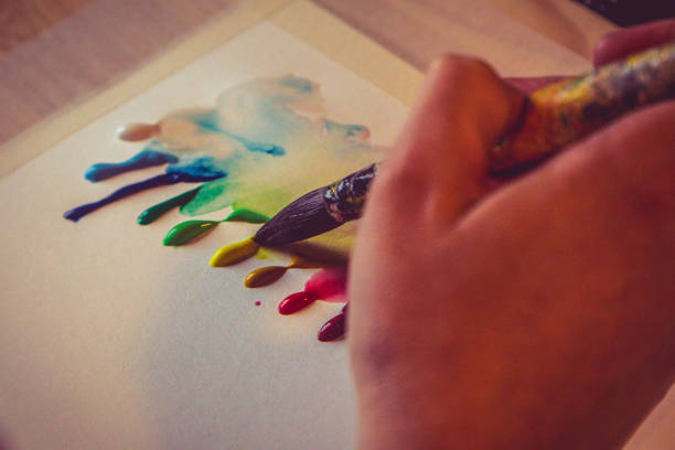 istock oil paint drop and brush 682352778