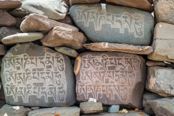 istock Mani stones wall with inscriptions. Trekking in Markha valley (Ladakh) 682356790