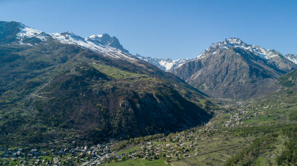 istock Aerial View Above Mountain Village with Drone 682359632