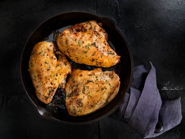 Grilled Bone in Chicken Breasts Grilled Chicken Breasts in a Cast Iron Pan chicken breast photos stock pictures, royalty-free photos & images