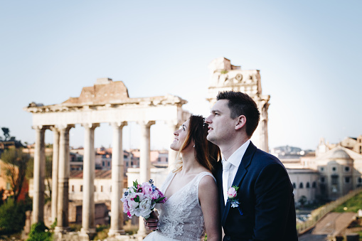 Bride and groom wedding poses in front of Roman Forum, Rome, Italy