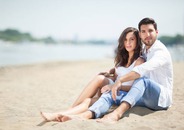 istock happy couple in love on beach,copy space.selective focus. 682402092