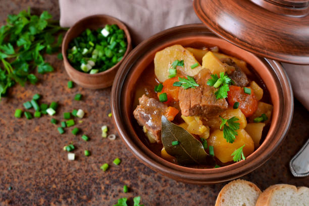 istock Stew with vegetables and potatoes on an old grunge background 682409120
