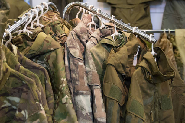 Samples camouflage military clothes in the store stock photo
