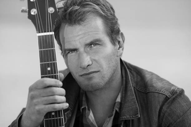 istock Black and white portrait of guitarist 682410612