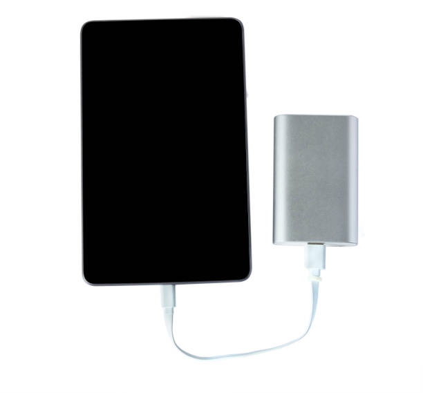 istock Tablet charging with portable external battery ( power bank ) isolated on a white background 682417012