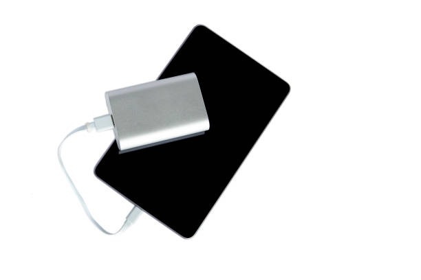 istock Power bank charging the tablet isolated on a white background 682417072