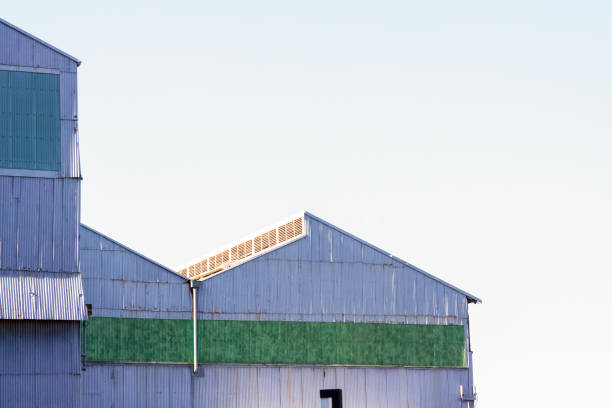 istock Old warehouse against sky background with copy space 682419806