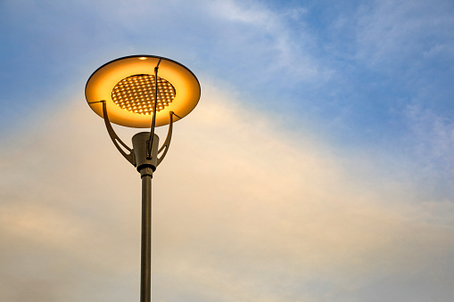 LED streetlight against a blue sky.