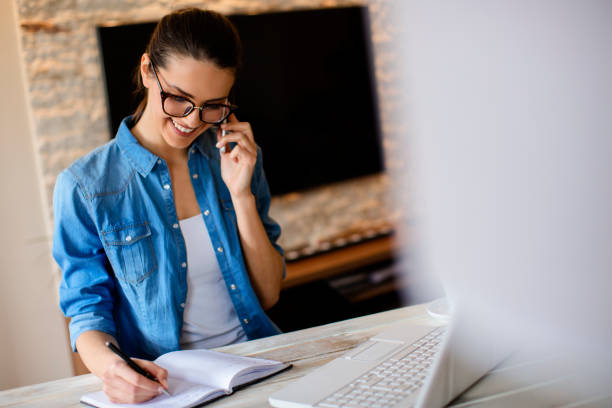 istock Young woman working at home 682428528
