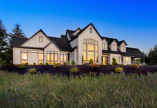 Beautiful Home Exterior at Night: Large Expansive and Stately Home