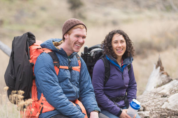 istock Two friends take a break from backpacking to admire the scenery 682432646