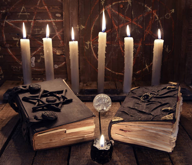 istock Esoteric still life with two black magic books and candles 682443574