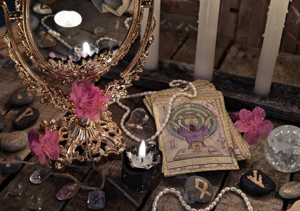 istock Close up with the tarot cards, mirror and black candle 682444416