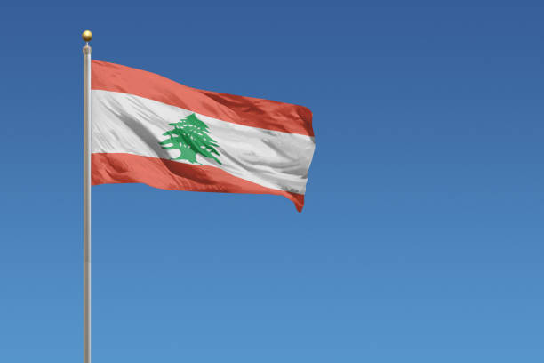Flag of Lebanon in front of a clear blue sky