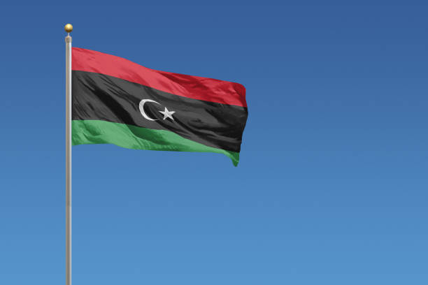 Flag of Libya Flag of Libya in front of a clear blue sky libya stock pictures, royalty-free photos & images