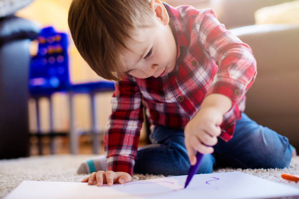 istock Little boy painting 682449206