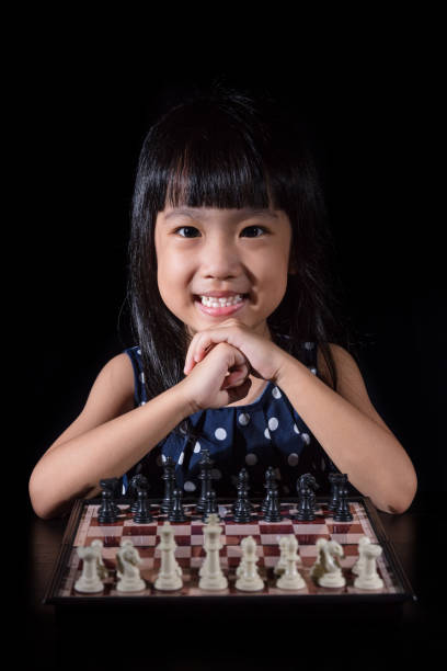 istock Asian Little Chinese girl playing chess 682462022