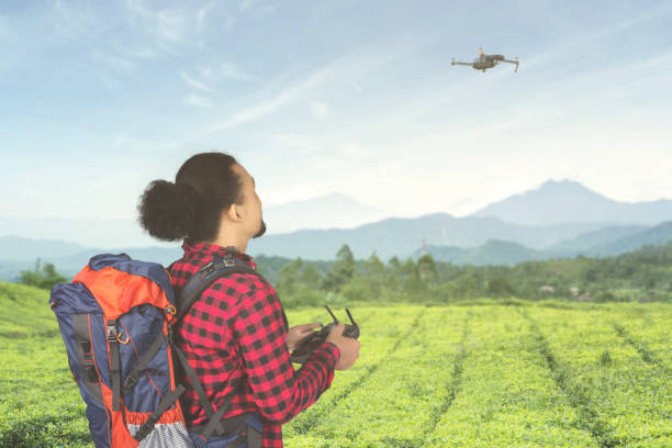 istock Male hiker operating a drone outdoors 682468954