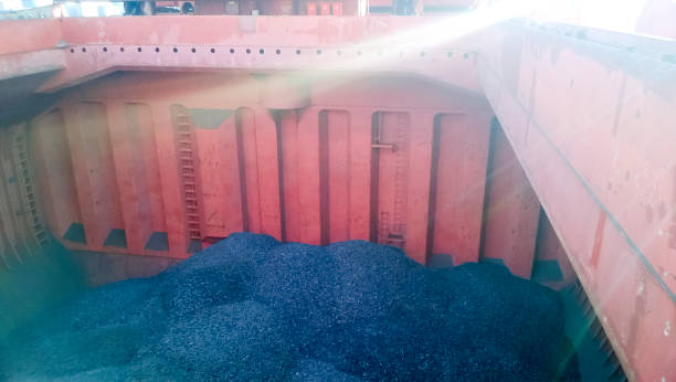 istock The cargo compartment of the ship, filled with coal. Loading of 682469012