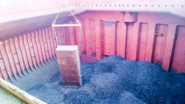 istock The cargo compartment of the ship, filled with coal. Loading of 682469030