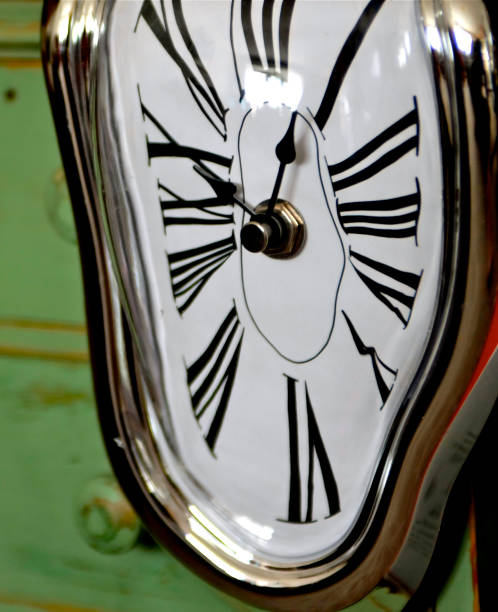 istock Dali style clock with roman numerals 682478640
