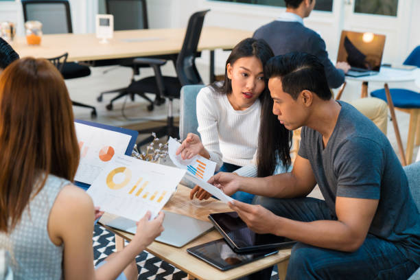 istock Team of young entrepreneurs comparing graphs 682482440