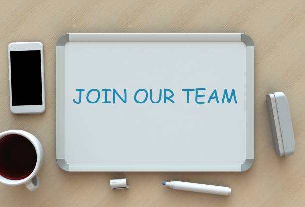istock JOIN OUR TEAM, message on whiteboard, smart phone and coffee on table 682485330
