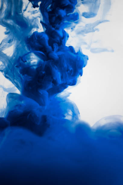 istock blue ink in water isolated on white background 682485666