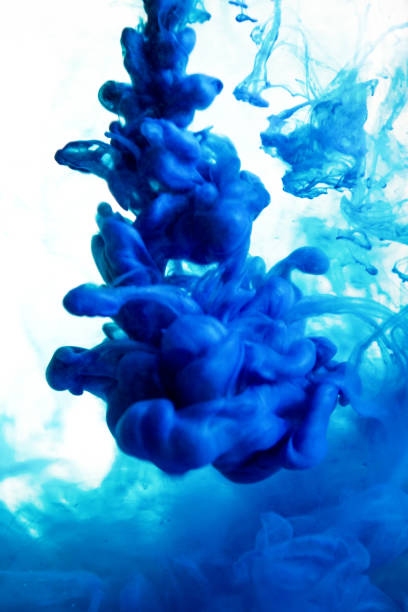 istock blue ink in water isolated on white background 682486034