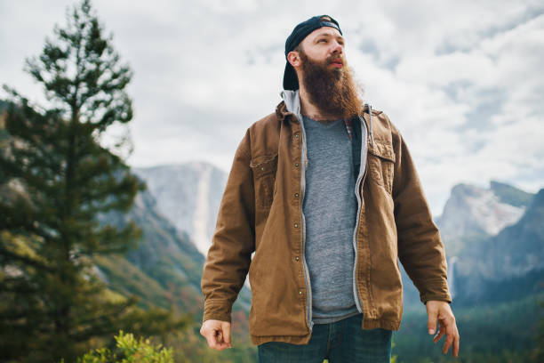 istock bearded guy in coat at Yosemite 682486126
