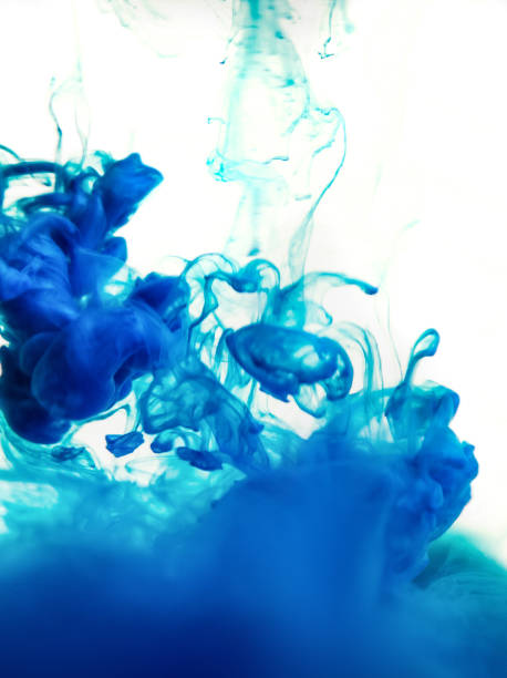 istock blue ink in water isolated on white background 682486286