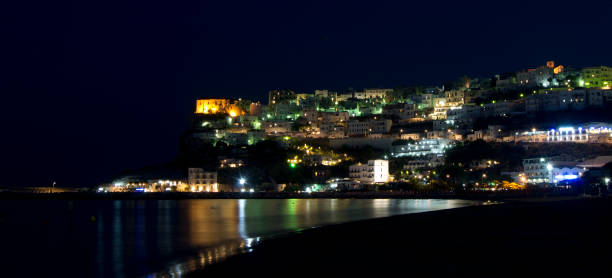 istock Peschici at night with lights and reflections 682488504