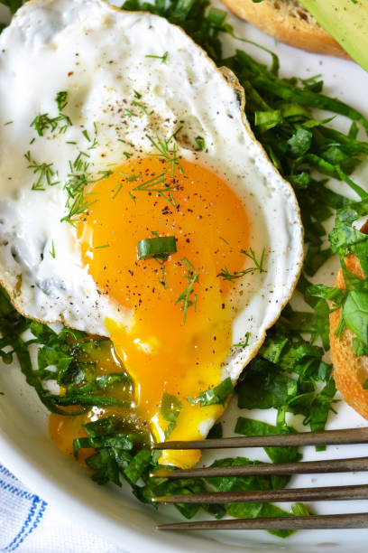 istock Good morning! Breakfast with toast with avocado, spinach and egg. 682488860