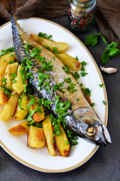 istock Baked mackerel with potatoes and spices for dinner 682489054