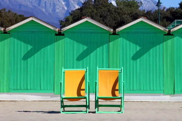 Forte dei Marmi winter sea huts with two deckchairs in winter