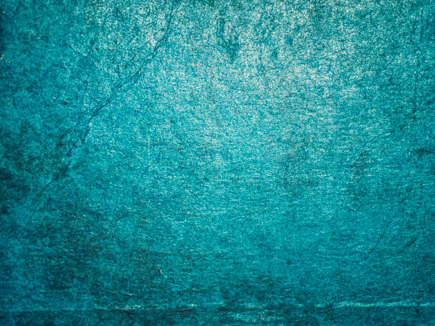 istock Cracking and peeling blue paint on a wall. Vintage wood background with peeling paint. Old board with Irradiated paint 682495984