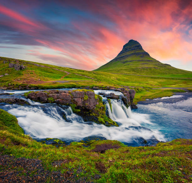 istock Summer sunset on famous Kirkjufellsfoss Waterfall and Kirkjufell mountain. 682497020