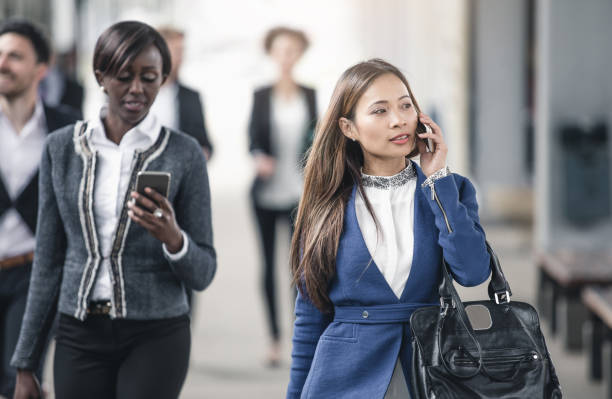 istock Business People Walking and Talking on the Phone 682516640