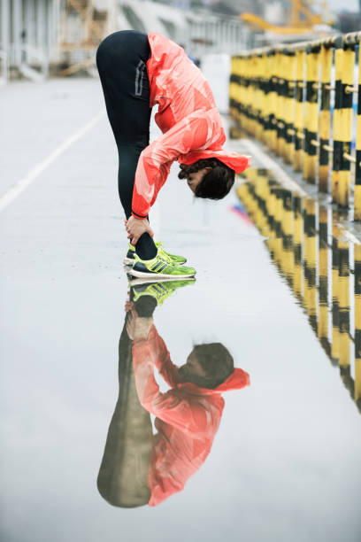 istock Fit woman stretches after jogging 682521310
