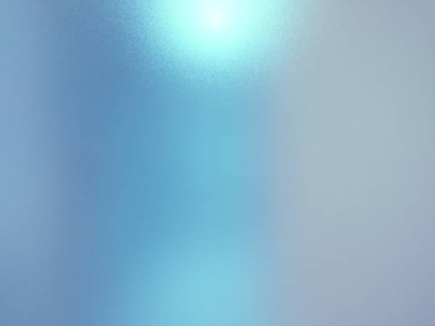 Blurred frosted glass texture background with light reflection, Grey and blue colors. stock photo