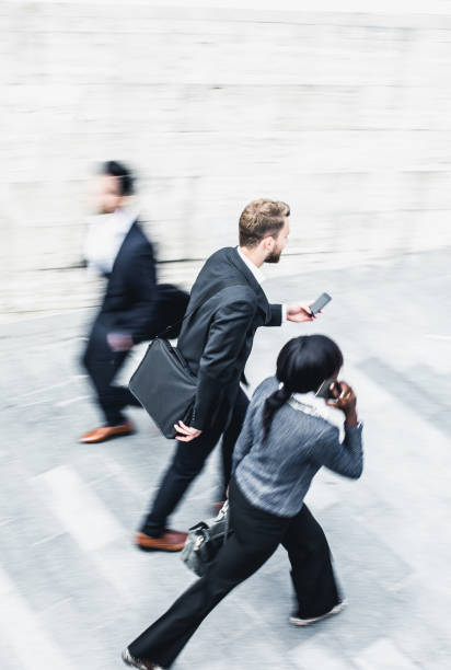 istock Blurred Business People Walking in the Street 682523732