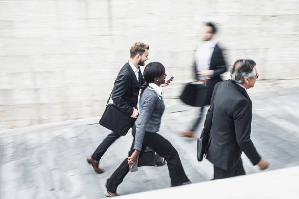 istock Blurred Business People Walking in the Street 682523740